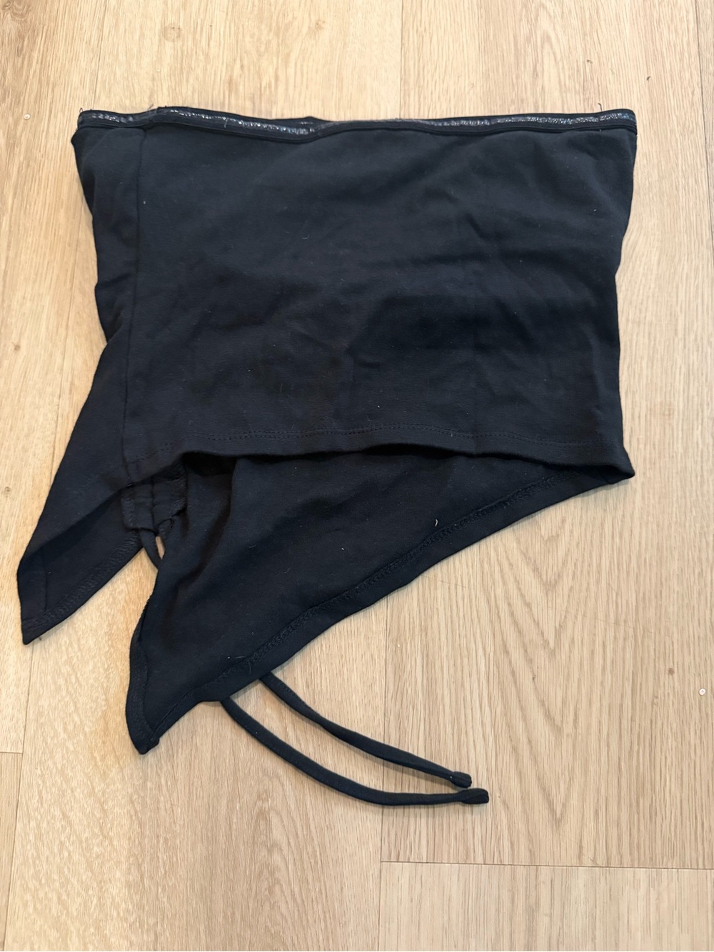 Black asymmetrical tube top with draping hem and tie-strap detail XXS